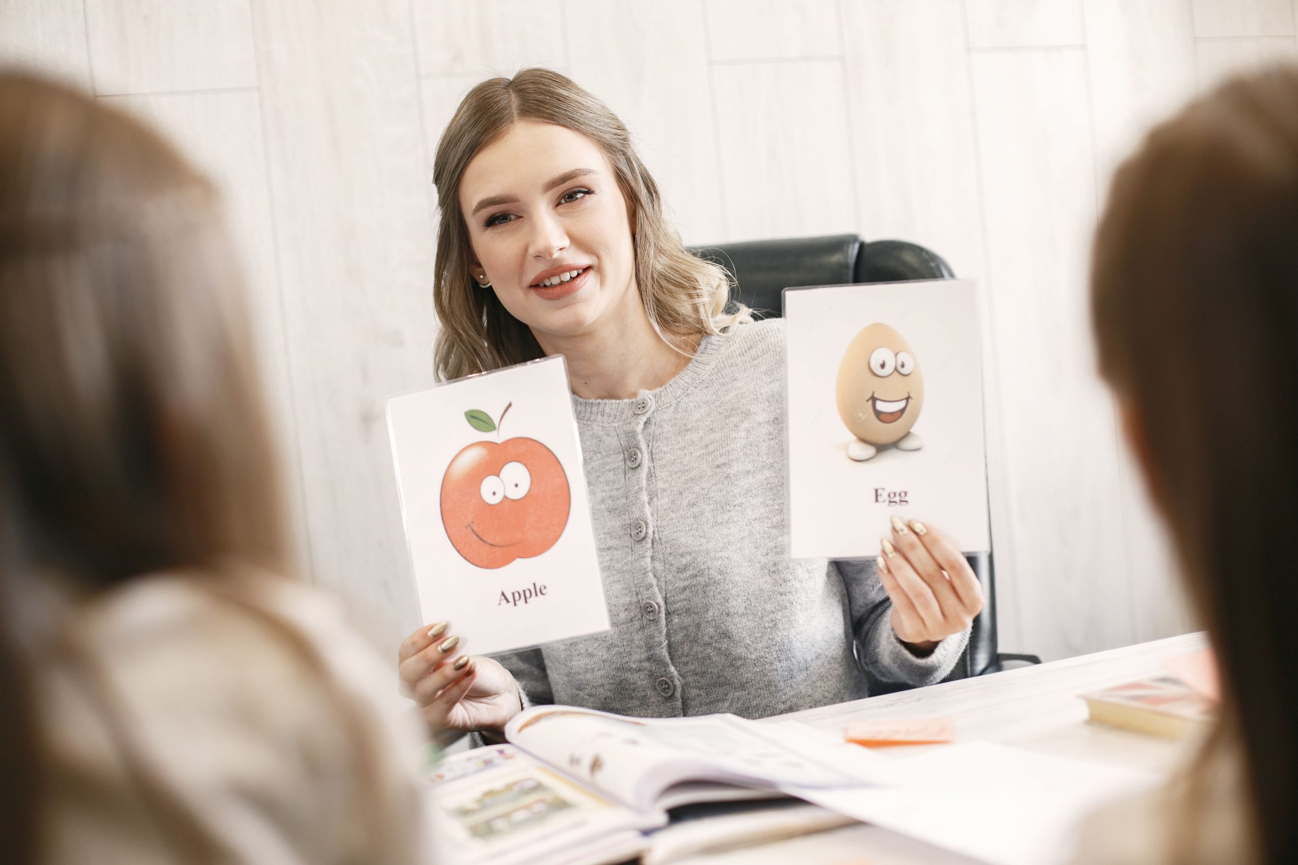 Speech-language pathologist using picture cards during a communication session