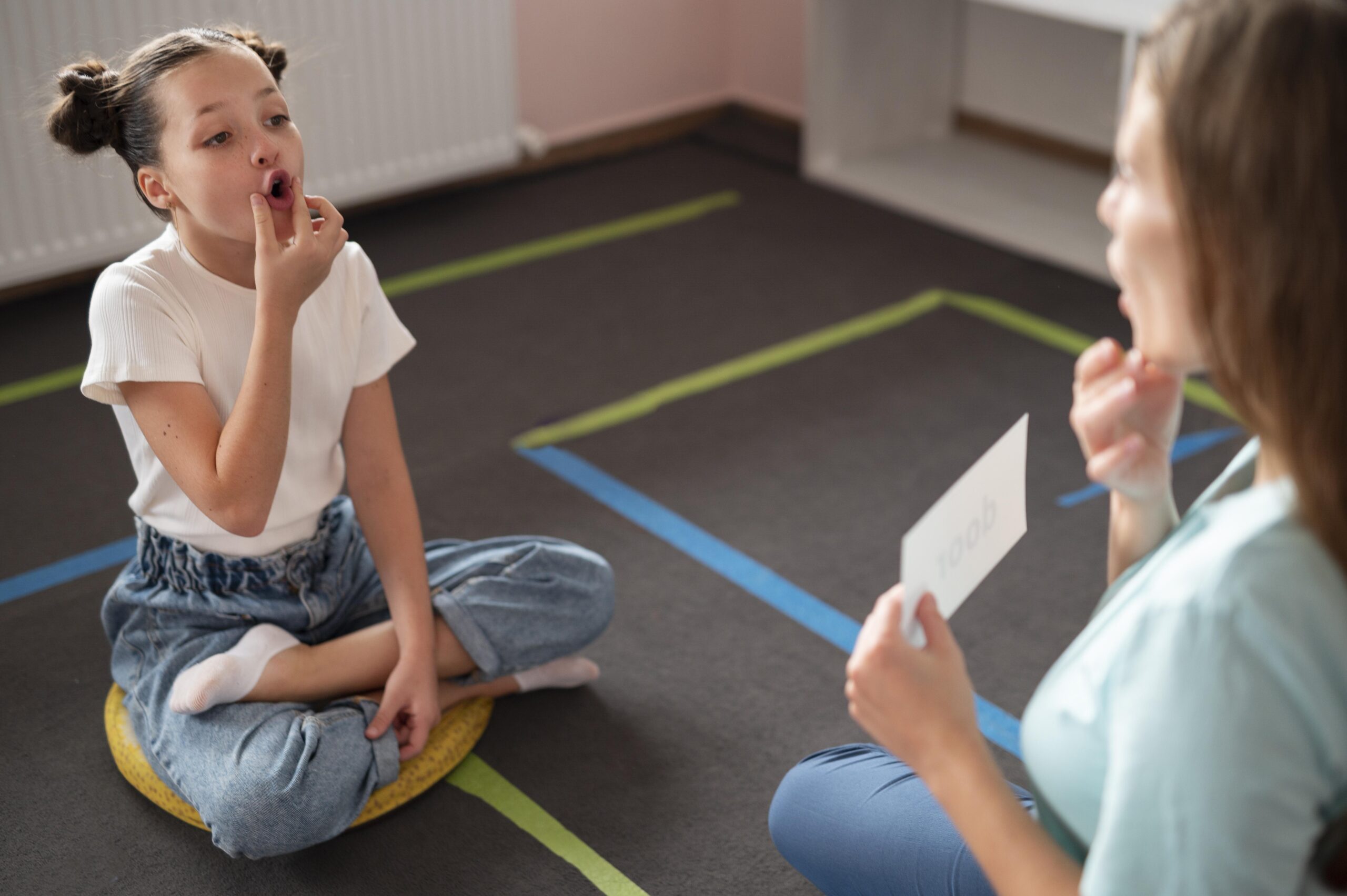 Speech-language pathologist guiding a client through a speech exercise
